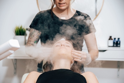 A women gets her faced steam at Oasis Face Bar.