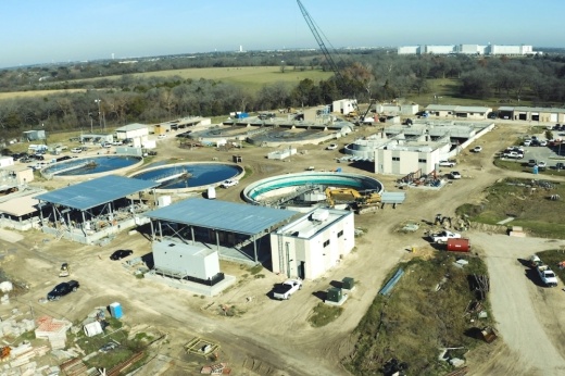 Construction of wastewater treatment facility expansion underway.