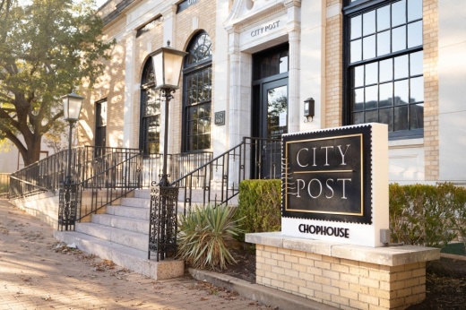 The entrance to the restaurant with a sign that reads "City Post Chophouse."