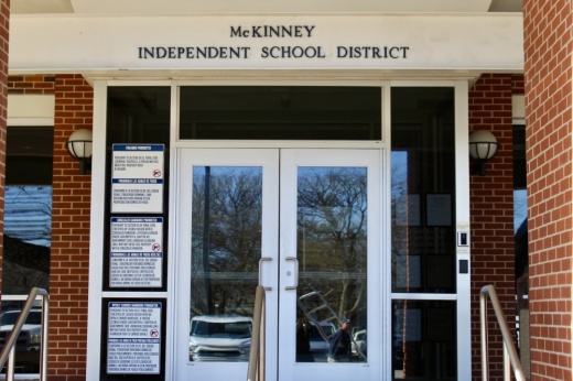 an entrance to a building that says McKinney Independent School District
