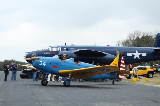 Close up of a small, blue vintage plane