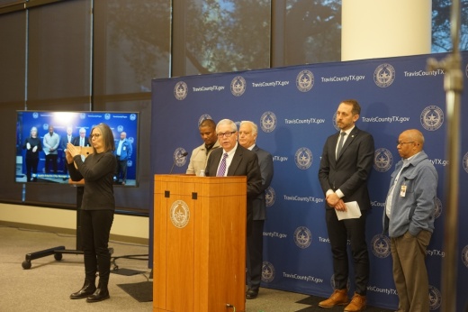 city leaders talking at a podium