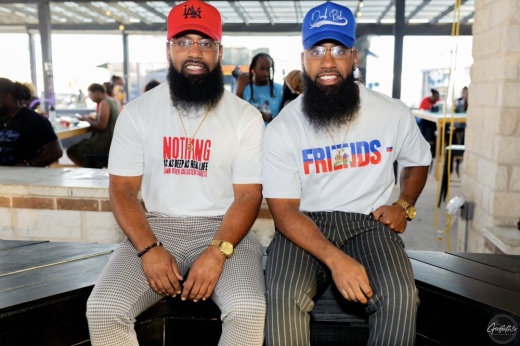 Two twin brothers smile at the camera, happy to be opening a new cajun restaurant in Pflugerville.
