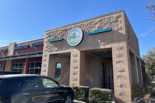 The exterior of the building is shown on a sunny, clear day.