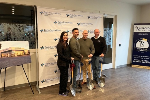 four individuals at a groundbreaking ceremony