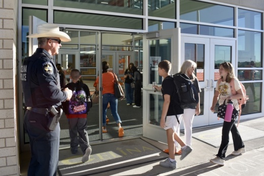 students walk into a school