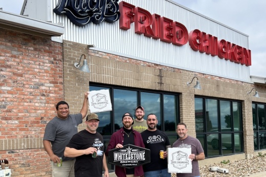The team poses in front of the former Lucy's Fried Chicken building.