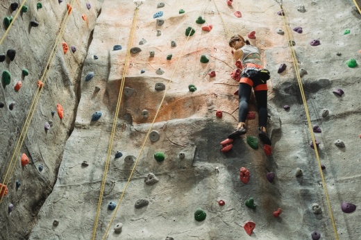 Indoor rock climber climbing