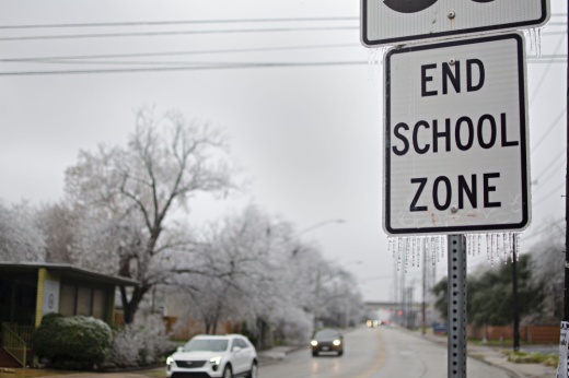 School zone sign with icy precipitation