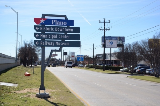A Plano wayfinding sign highlighting attractions and facilities in downtown Plano