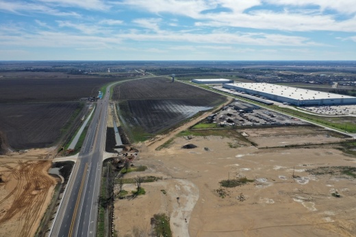 an aerial view of the new FM 110 segment near the Amazon fulfillment center