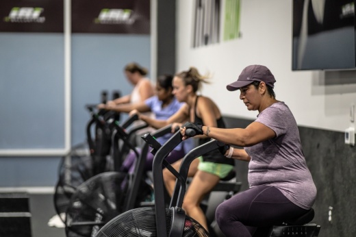 People cycling in a gym