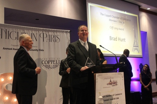 man speaking at a podium