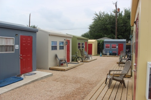A row of colorful tiny homes at the Esperanza Community in East Austin.