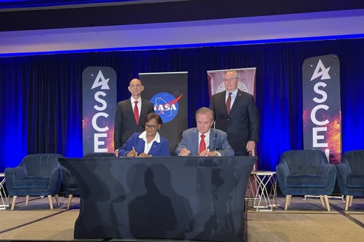 Officials sign the lease for the new Texas A&M Space Institute.