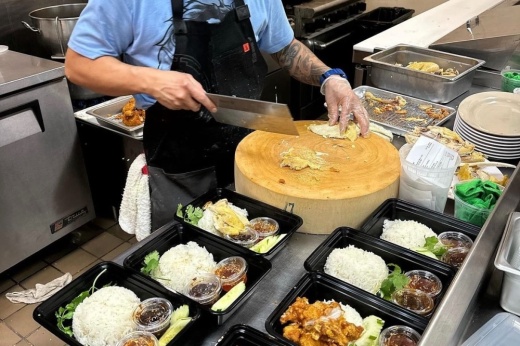 The owner is shown in the kitchen preparing meals.