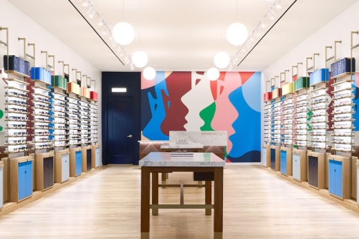 Inside of Warby Parker store in mall with shelves of glasses