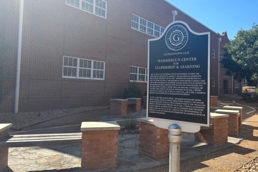 Historic signage details the history of the GISD central office