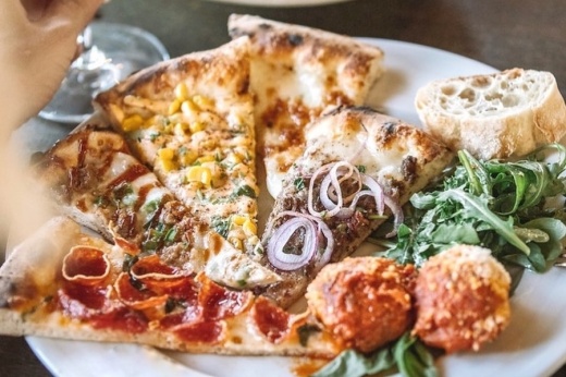 variety of different types of pizzas