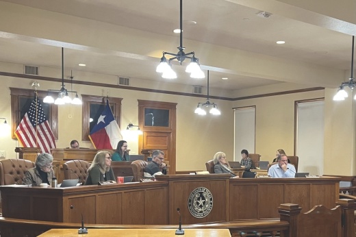 Commissioners sit at the dais as they appoint a new president of the Williamson County ESD No. 3.