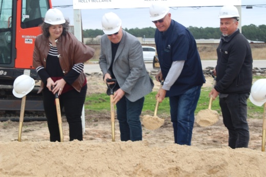 People with shovels and dirt.
