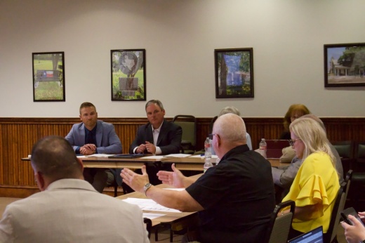 The photo shows MISD Superintendent Mark Ruffin (left) and Chief Operations Officer Kris Lynn (right) meeting with Montgomery City Council.