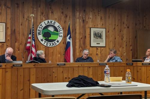 Left to right West Lake Hills city administrator, mayor and council members sitting at dais during Feb. 28 city council meeting