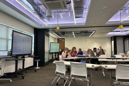 Administrators discuss the budget in a conference room