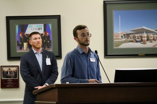 The photo shows Zack Boles (left), Tomball ISD's chief financial officer, and Evan Sitler (right), a project geologist for Houston engineering firm Terracon, speaking.