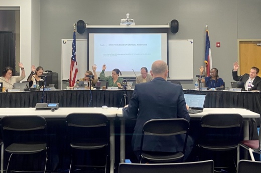 The board of trustees take a vote