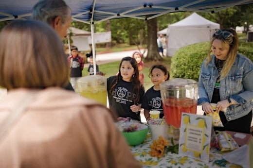 People at market selling beverages