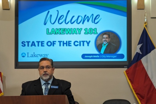 Lakeway City Manager Joseph Molis stands at a podium delivering Lakeway's State of the City address on March 7.