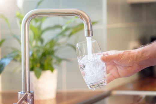 glass being filled with tap water