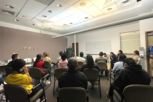 The Most Rev. Gustavo García-Siller, archbishop of San Antonio, celebrates Mass with migrants at San Antonio’s Migrant Resource Center in October 2022. City officials said 600,000-plus migrants have traveled through town since early 2021. (Courtesy Catholic Charities)