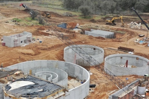 An aerial view of a wastewater treatment plant under construction.