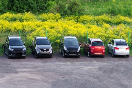 five cars parked in a row