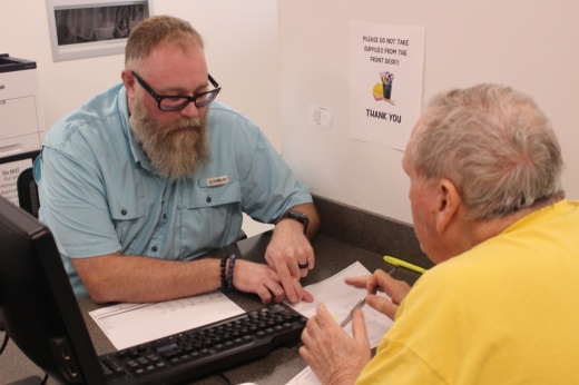 Two people speaking across a table