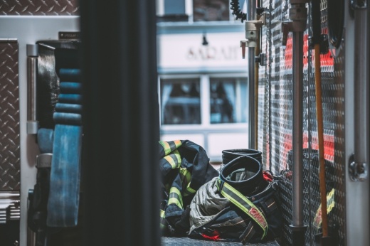 a firefighter uniform on the floor of a fire engine
