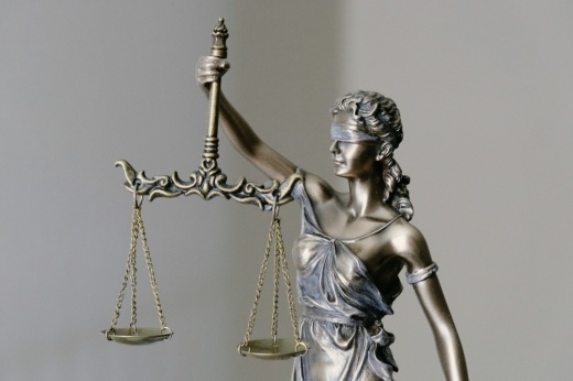 A statue of a woman holding the scales of justice