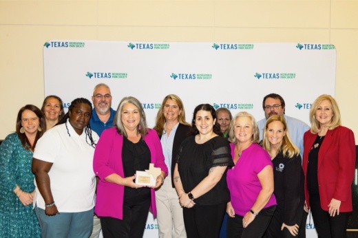 A photo of West U officials standing next to their award.