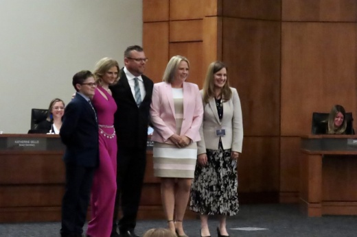 Will Skelton posed with family at LISD board meeting