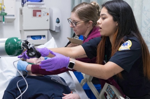 Junior college students participate in hands-on EMS training