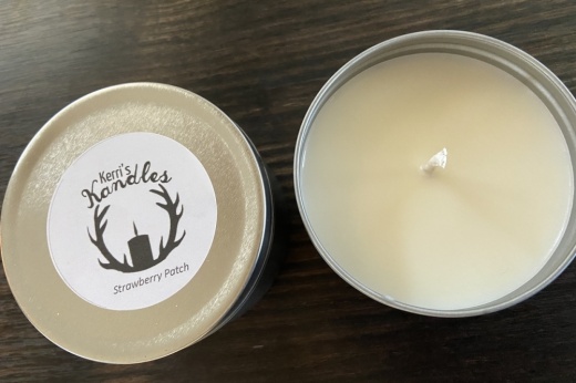 candle with business logo on lid
