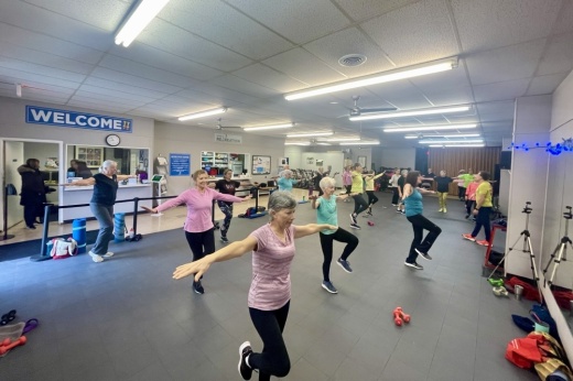 Adults in a workout room.