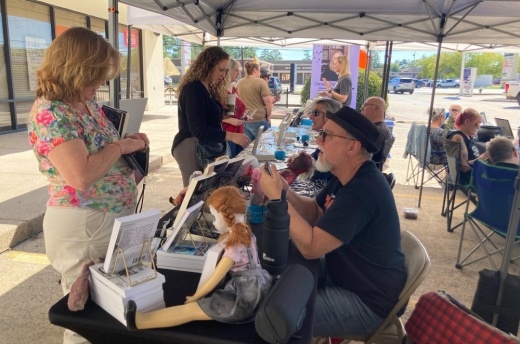 A photo of authors interacting with attendees at a previous author fair hosted by Copperfield's Books