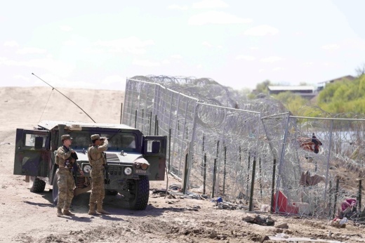 Two Texas National Guard soldiers at the Texas-Mexico border.