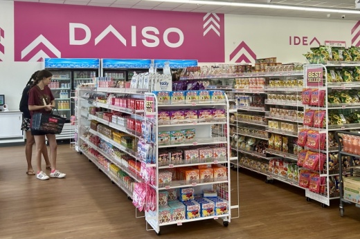 Two women browse at a Daiso store
