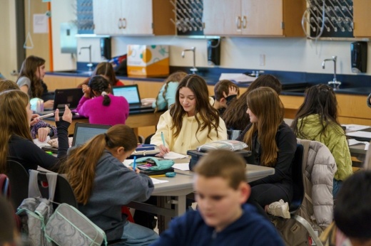 Students crowd classroom tables at Argyle Middle School