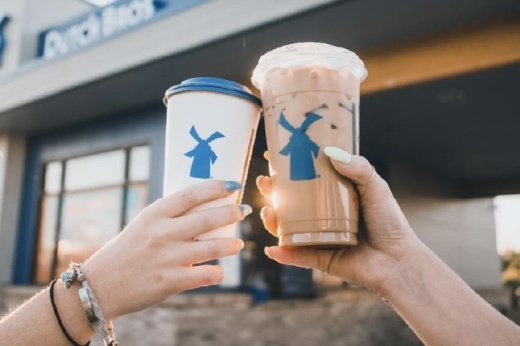 People holding drinks from Dutch Bros Coffee.