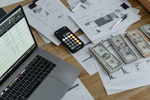 Computer, calculator, forms, money